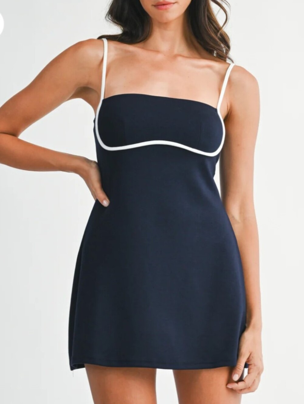 Sporty, flared dress designed for both performance and style. Built in shorts